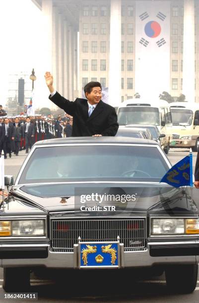 South Korean President Roh Moo-Hyun waves 25 February 2003 after Roh's swear-in ceremony outside South Korea's National Assembly building. Roh was...