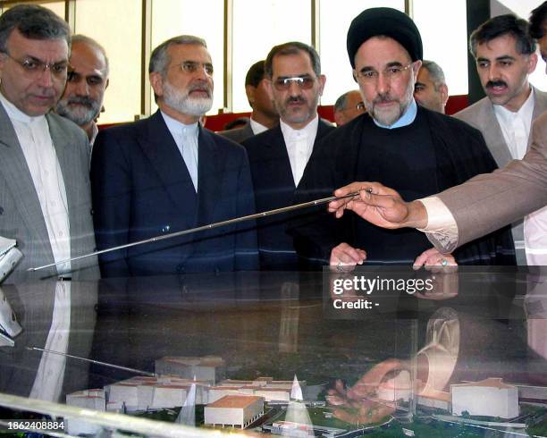 Iranian President Mohammed Khatami looks at a model during his visit at the Hi-Tech city in Hyderabad, 28 January 2003. Khatami visited visit the...