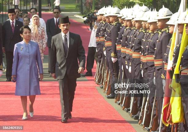 President Gloria Arroyo of the Philippines and Brunei Sultan Hassanal Bolkiah inspect honor guards during arrival ceremonies at the Malacanang...