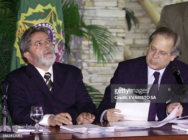 President of Brazil Luiz Inácio Lula da Silva and chief of Staff Jose Dirceu work during a ministers meeting 10 February 2003 in Brasilia, Brazil....