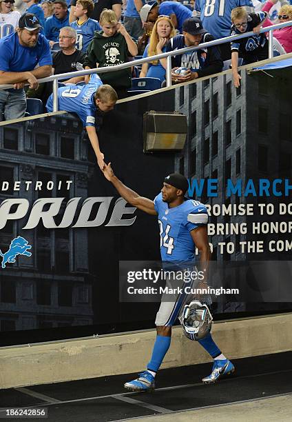 Ryan Broyles of the Detroit Lions shakes hands with a fan during the game against the Cincinnati Bengals at Ford Field on October 20, 2013 in...