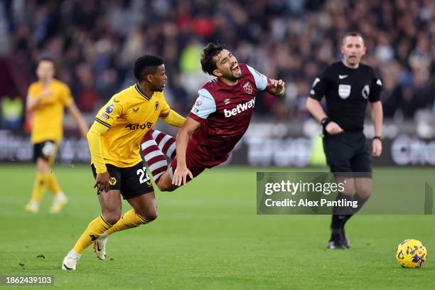 Nelson Semedo of Wolverhampton Wanderers fouls Lucas Paqueta of West Ham United during the Premier League match between West Ham United and...