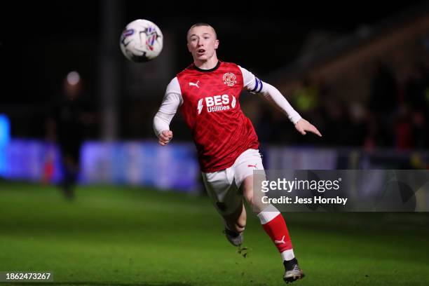 Mikey Lane of Fleetwood Town runs with the ball during the FA Youth Cup Third Round match between Fleetwood Town U18 and Liverpool FC U18 at Highbury...
