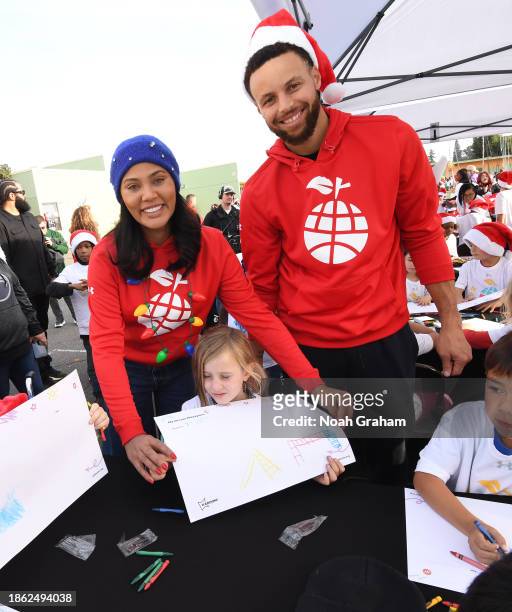 Ayesha Curry and Stephen Curry attend Stephen & Ayesha Curry's Eat. Learn. Play.'s 11th Annual Christmas with the Currys Celebration at Manzanita...