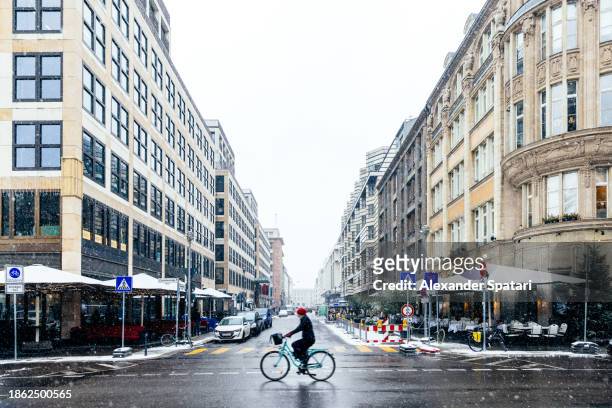 street in mitte district on a snowy day, berlin, germany - mitte bildbanksfoton och bilder