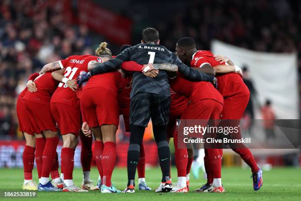 Liverpool players enter a huddle prior to the Premier League match between Liverpool FC and Manchester United at Anfield on December 17, 2023 in...