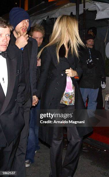 Actress Gwyneth Paltrow and boyfriend, musician Chris Martin of Coldplay leave Madison Square Garden after the 45th Annual Grammy Awards on February...