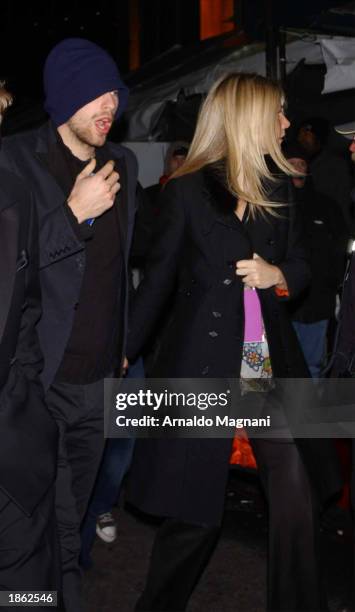 Actress Gwyneth Paltrow and boyfriend, musician Chris Martin of Coldplay leave Madison Square Garden after the 45th Annual Grammy Awards on February...