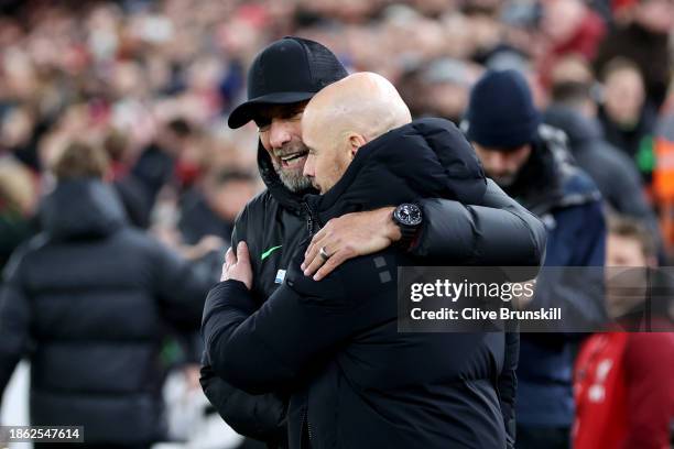 Juergen Klopp, Manager of Liverpool, embraces Erik ten Hag, Manager of Manchester United, prior to the Premier League match between Liverpool FC and...