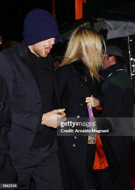 Actress Gwyneth Paltrow and boyfriend musician Chris Martin of Coldplay leave Madison Square Garden after the 45th Annual Grammy Awards on February...