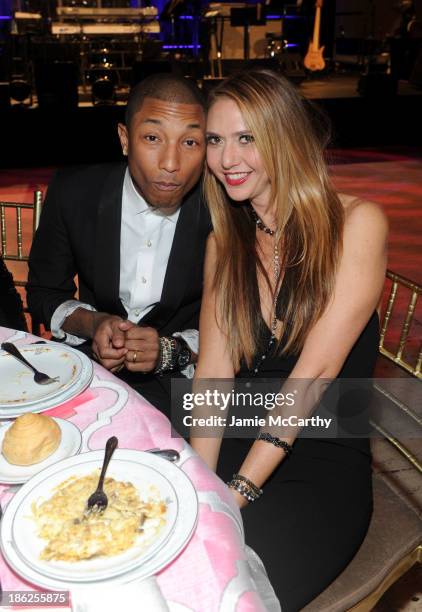 Musician Pharrell Williams and Jewelry Designer Ofira Sandberg attend Gabrielle's Angel Foundation Hosts Angel Ball 2013 at Cipriani Wall Street on...