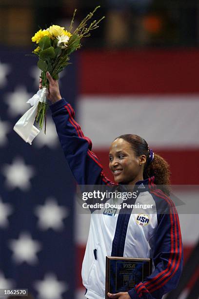 Annia Hatch of the USA poses on the podium after winning third place in the women's all-around at the 2003 VISA American Cup USA Gymnastics...