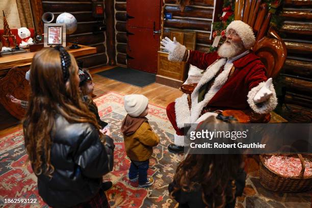 Los Angeles, Ca, Wednesday, November 29, 2023 - Children meet Santa Claus in Skypark at Santa's Village.