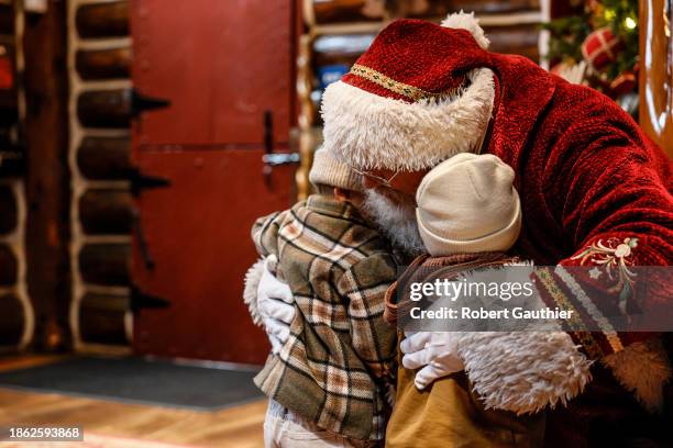 Los Angeles, Ca, Wednesday, November 29, 2023 - Children meet Santa Claus in Skypark at Santa's Village.