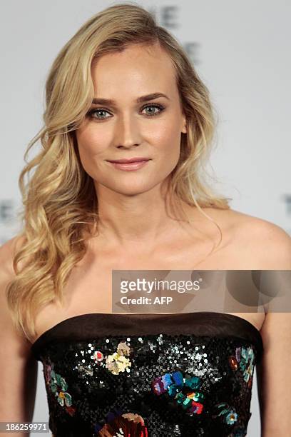 Diane Kruger poses as she arrives for the opening ceremony of the Little Black Jacket exhibition of Chanel in Sao Paulo, Brazil, October 29, 2013....