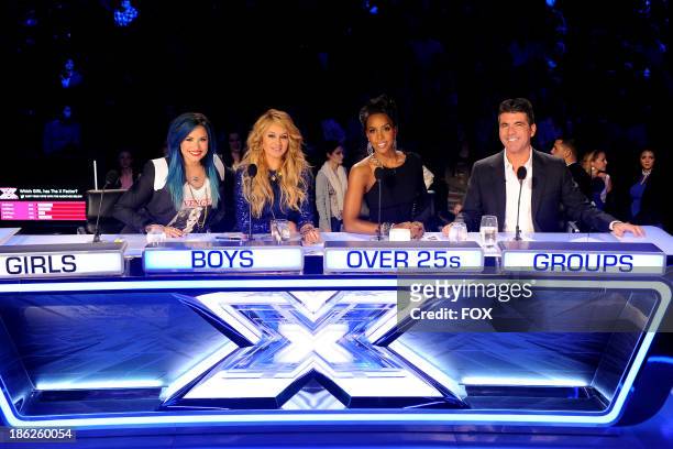 Judges Demi Lovato, Paulina Rubio, Kelly Rowland and Simon Cowell on FOX's "The X Factor" Season 3 Top 16 Live Performance Show on October 29, 2013...