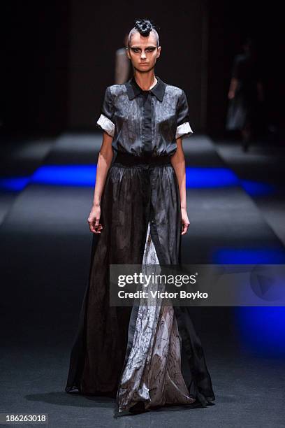 Model walks the runway at the Muscovites by Mashsa Kravtsova show of Mercedes-Benz Fashion Week S/S 14 on October 29, 2013 in Moscow, Russia.