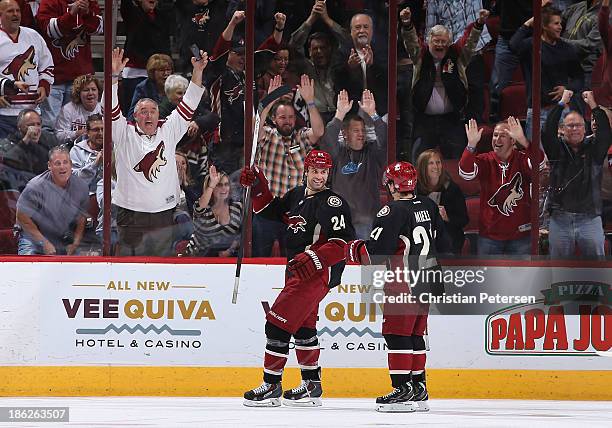 Kyle Chipchura of the Phoenix Coyotes celebrates with Andy Miele after scoring a third period goal against the Los Angeles Kings during the NHL game...