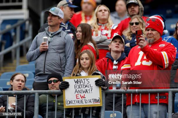 Fan holds a sign referencing Taylor Swift prior to a game between the Kansas City Chiefs and the New England Patriots at Gillette Stadium on December...