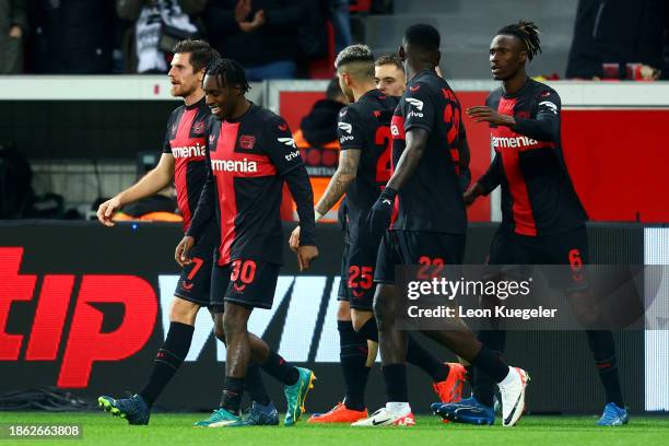 Jeremie Frimpong of Bayer Leverkusen celebrates with teammates after scoring their team's second goal during the Bundesliga match between Bayer 04...