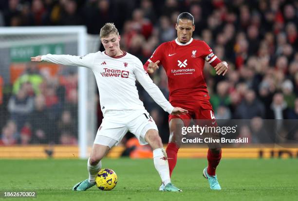 Rasmus Hojlund of Manchester United is challenged by Virgil van Dijk of Liverpool during the Premier League match between Liverpool FC and Manchester...