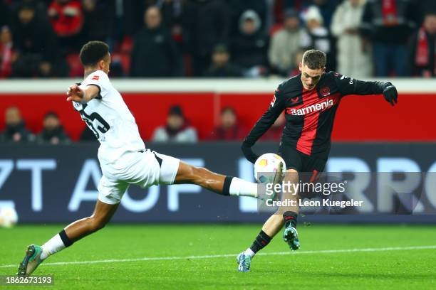 Florian Wirtz of Bayer Leverkusen scores their team's third goal during the Bundesliga match between Bayer 04 Leverkusen and Eintracht Frankfurt at...