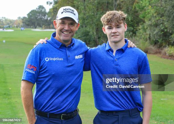 Padraig Harrington of Ireland poses for a photograph with his son Ciaran Harrington on the first hole during the final round of the PNC Championship...