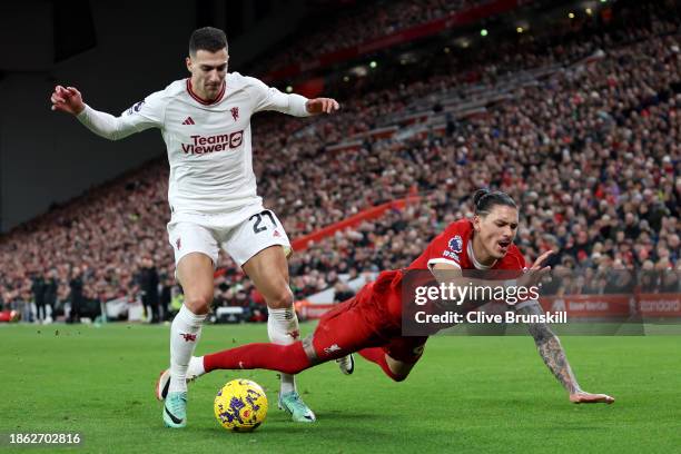 Diogo Dalot of Manchester United battles for possession with Darwin Nunez of Liverpool during the Premier League match between Liverpool FC and...