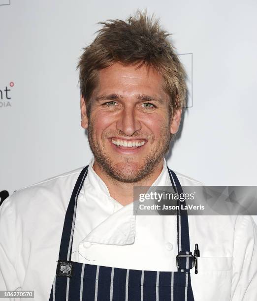 Chef Curtis Stone attends Share Our Strength's No Kid Hungry dinner at Ron Burkle's Green Acres Estate on October 29, 2013 in Beverly Hills,...