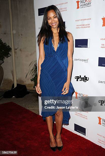 Actress Zoe Saldana attends Share Our Strength's No Kid Hungry dinner at Ron Burkle's Green Acres Estate on October 29, 2013 in Beverly Hills,...