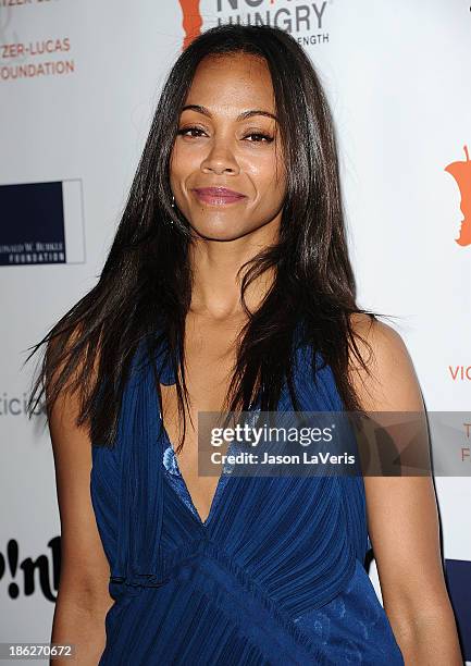 Actress Zoe Saldana attends Share Our Strength's No Kid Hungry dinner at Ron Burkle's Green Acres Estate on October 29, 2013 in Beverly Hills,...