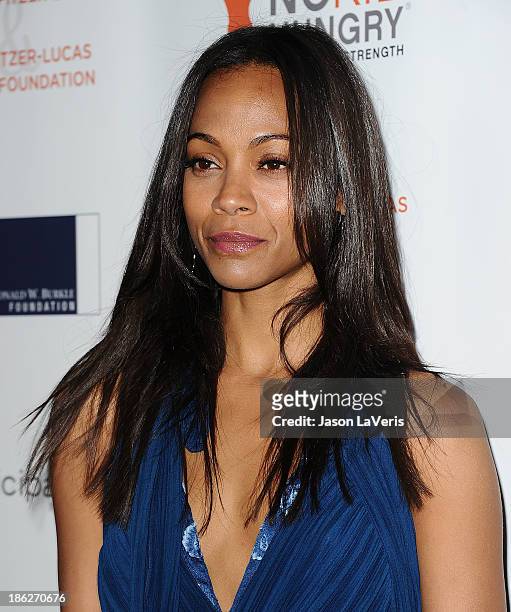 Actress Zoe Saldana attends Share Our Strength's No Kid Hungry dinner at Ron Burkle's Green Acres Estate on October 29, 2013 in Beverly Hills,...