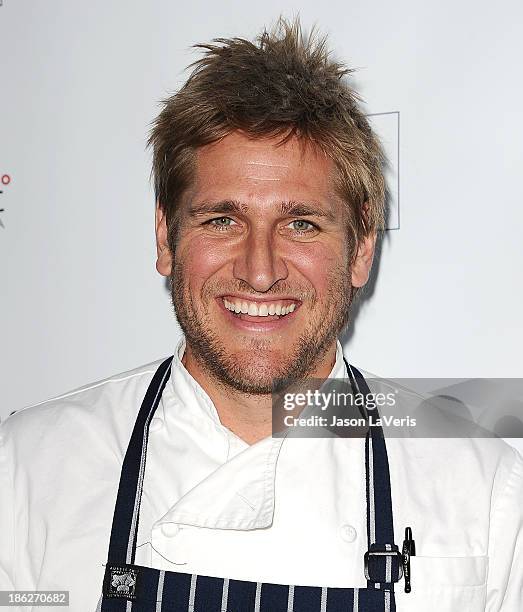 Chef Curtis Stone attends Share Our Strength's No Kid Hungry dinner at Ron Burkle's Green Acres Estate on October 29, 2013 in Beverly Hills,...
