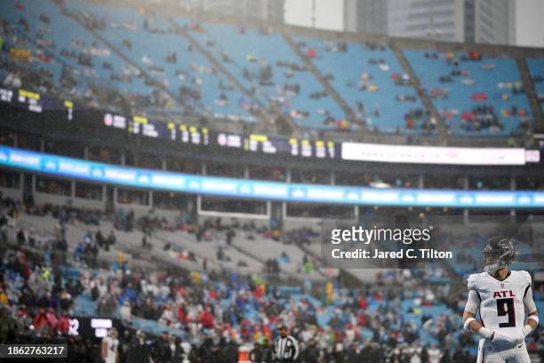 Desmond Ridder of the Atlanta Falcons looks on during the game against the Carolina Panthers at Bank of America Stadium on December 17, 2023 in...