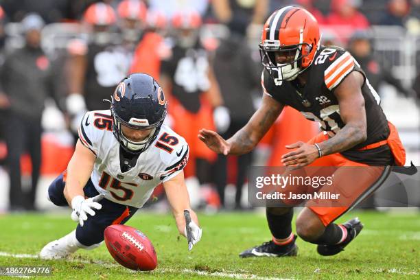 Trent Taylor of the Chicago Bears jumps on a dropped punt as Pierre Strong Jr. #20 of the Cleveland Browns looks on during the first quarter at...