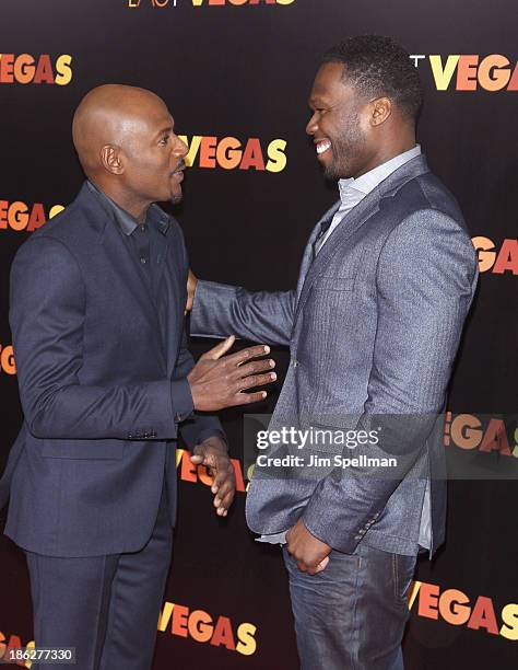 Actor Romany Malco and rapper 50 Cent attend the "Last Vegas" premiere at the Ziegfeld Theater on October 29, 2013 in New York City.