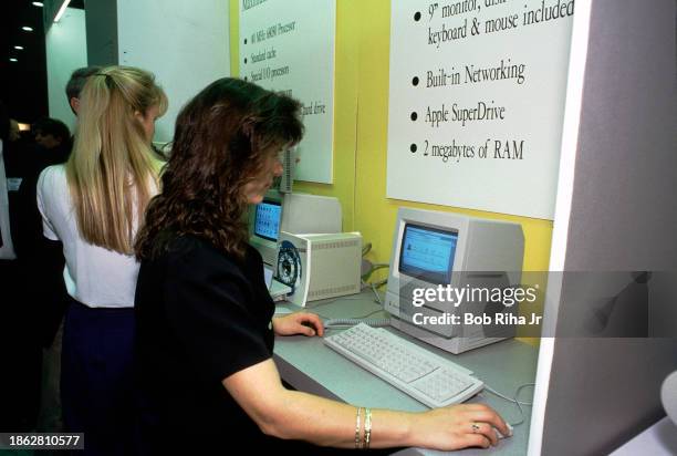 Computer Users try the newest Apple Macintosh computers including IIfx, IIsi, Classic and Classic SE models at Macintosh LA computer show, circa...