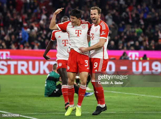 Kim Min-Jae of Bayern Munich celebrates with teammate Harry Kane of Bayern Munich after scoring a goal that was later disallowed for offside during...