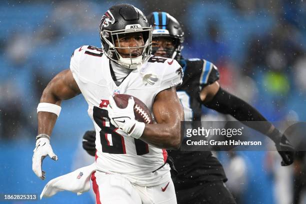 Jonnu Smith of the Atlanta Falcons carries the ball during the first half of the game against the Carolina Panthers at Bank of America Stadium on...