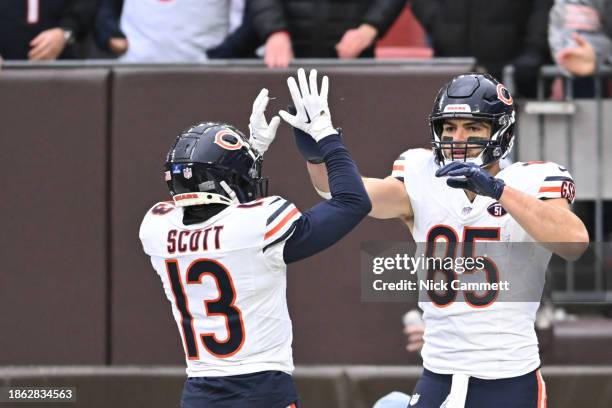 Tyler Scott celebrates with Cole Kmet of the Chicago Bears after a second quarter touchdown against the Cleveland Browns at Cleveland Browns Stadium...