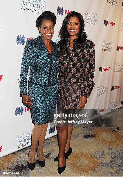 Personality Omarosa Manigault and her mother Theresa Manigault arrive at the 2013 International Women's Media Foundation's Courage In Journalism...