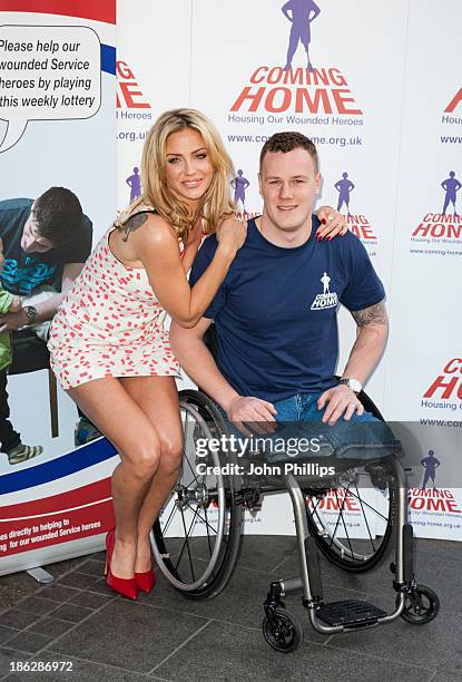 Sarah Harding attends a photocall to launch the Coming Home lottery ticket at Hippodrome Casino on October 30, 2013 in London, England.