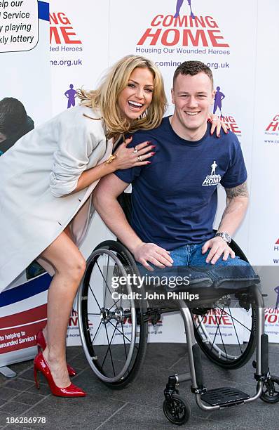 Sarah Harding attends a photocall to launch the Coming Home lottery ticket at Hippodrome Casino on October 30, 2013 in London, England.