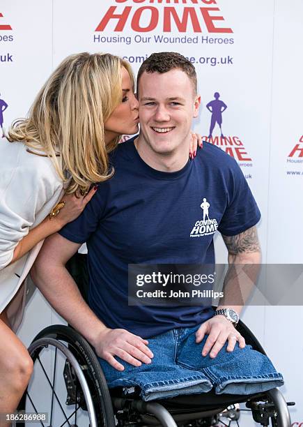 Sarah Harding attends a photocall to launch the Coming Home lottery ticket at Hippodrome Casino on October 30, 2013 in London, England.