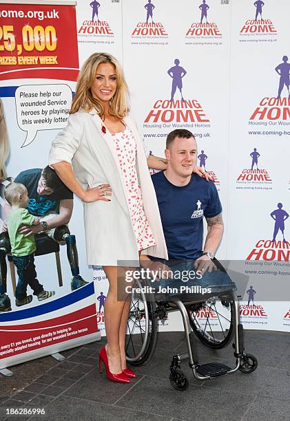 Sarah Harding attends a photocall to launch the Coming Home lottery ticket at Hippodrome Casino on October 30, 2013 in London, England.