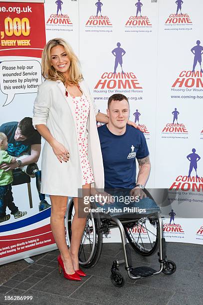 Sarah Harding attends a photocall to launch the Coming Home lottery ticket at Hippodrome Casino on October 30, 2013 in London, England.