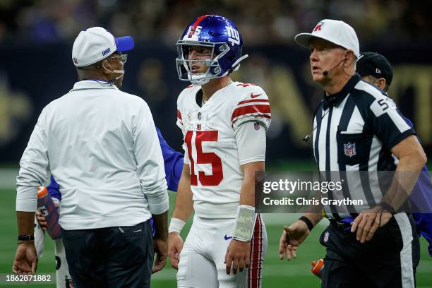 Tommy DeVito of the New York Giants walks off the field during the first half of the game against the New Orleans Saint at Caesars Superdome on...
