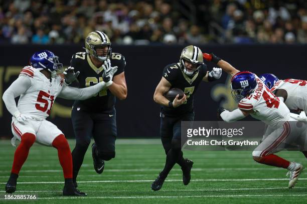 Taysom Hill of the New Orleans Saints carries the ball during the first half of the game against the New York Giants at Caesars Superdome on December...