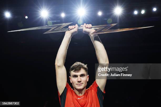 Jack 'The Power' Draper of Great Britain lifts the trophy after winning the Final match against Holger 'The Viking' Rune during Day Three of the UTS...