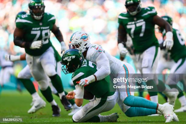 Bradley Chubb of the Miami Dolphins sacks Zach Wilson of the New York Jets during the second quarter at Hard Rock Stadium on December 17, 2023 in...